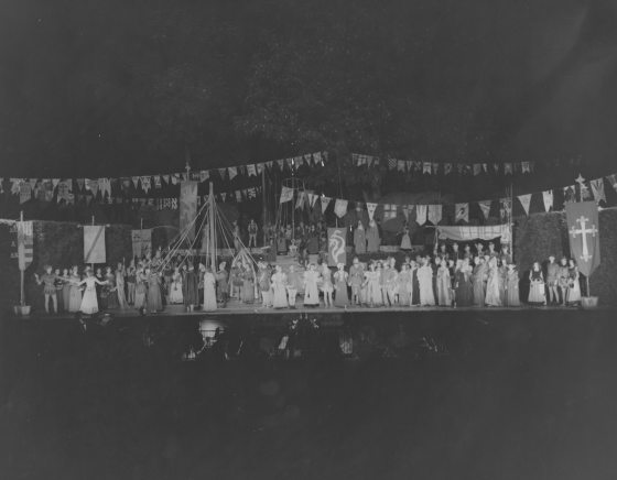 A theater cast on stage. 